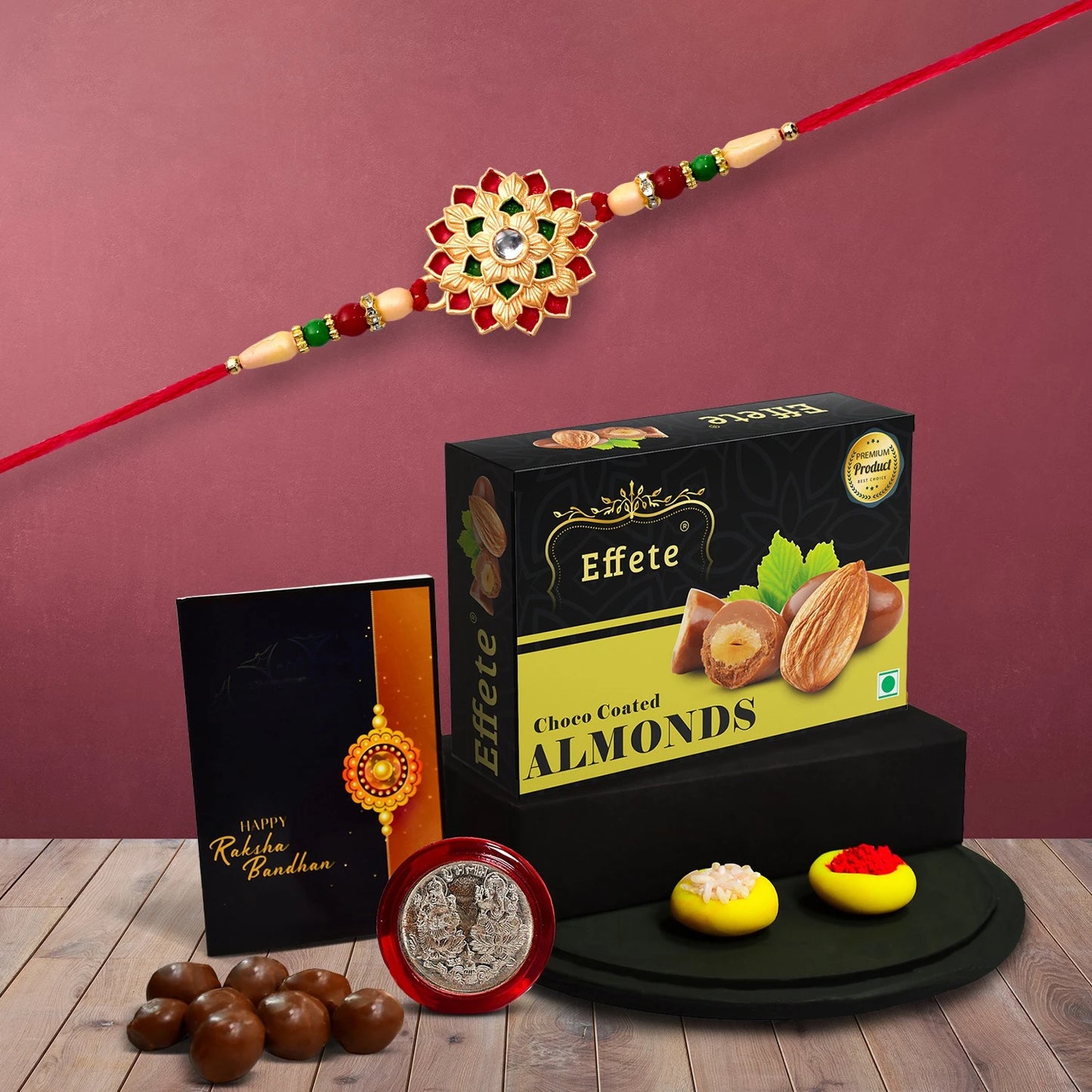Premium Rakhi Gift Combo With Floral Rakhi Choco Coated Almonds Silver Coin Tilak Set Greeting Card For Brother